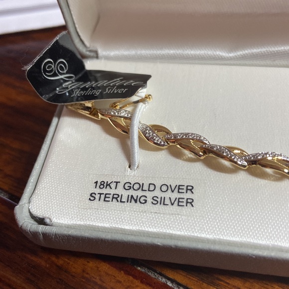 7” gold over silver bracelet. Small diamond chips throughout. Very pretty. - Picture 1 of 7